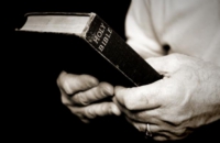 Man_holding_bible-63271
